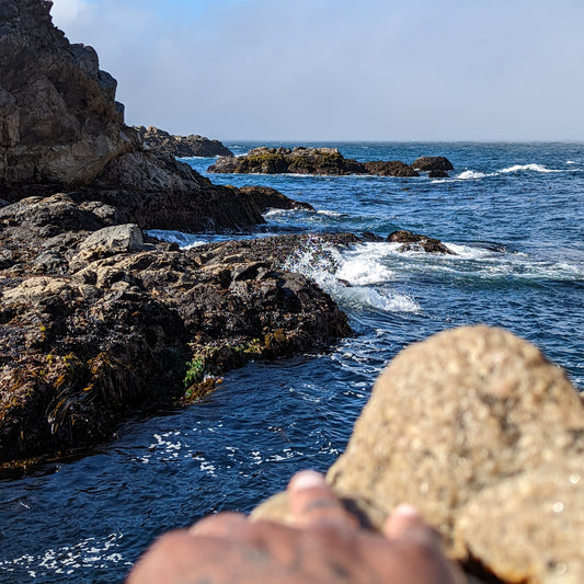 Freediving location in Carmel. Rocky shore with waves crashing on shore