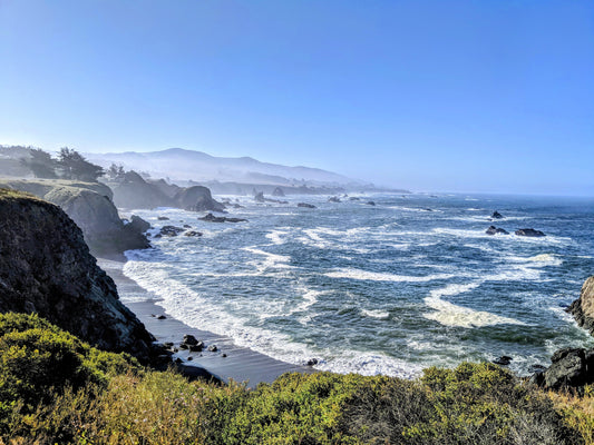 Freediving location near fort ross, California.  Picture of waves rolling in below the cliffside. White capped waves