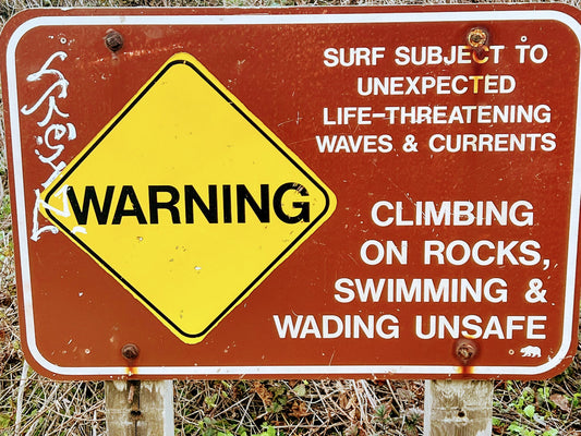 Warning sign commonly seen near locations where Freedivers are.  Surf warning sign.